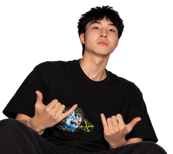 KimchiOS in a black tee, flashing two shakas